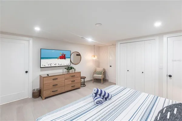 a bedroom with a bed and a dresser