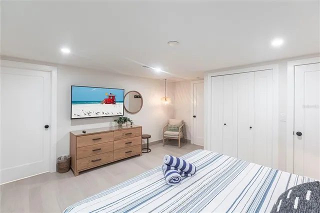 a bedroom with a bed and a dresser