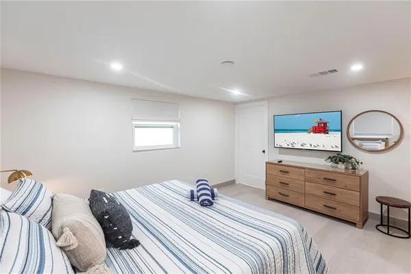 a bedroom with a bed and a dresser