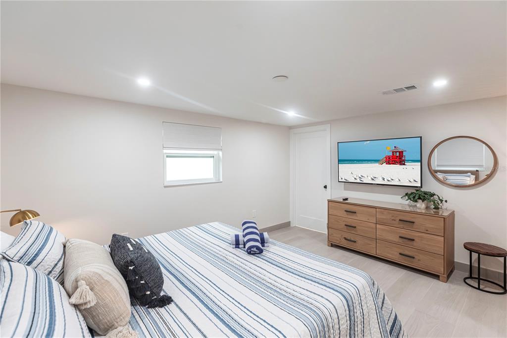 6154 Midnight Pass Road, Unit B18 Sarasota, FL 34242 - Photo 12 of 20 a bedroom with a bed and a dresser