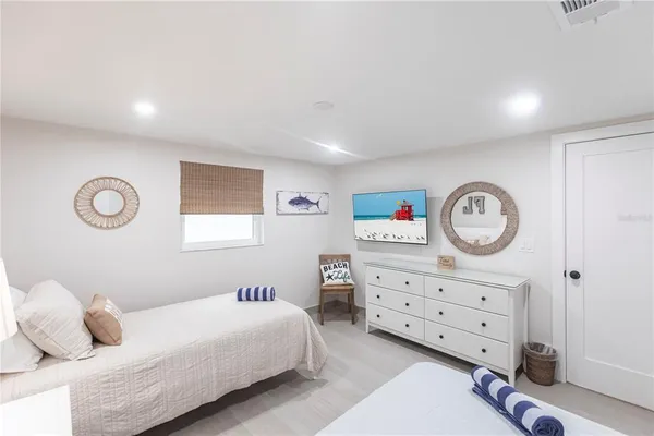 a bedroom with a bed and a closet