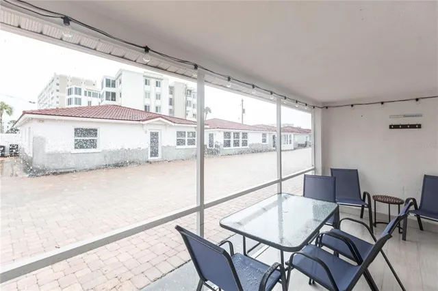 a view of a room with furniture and wooden floor