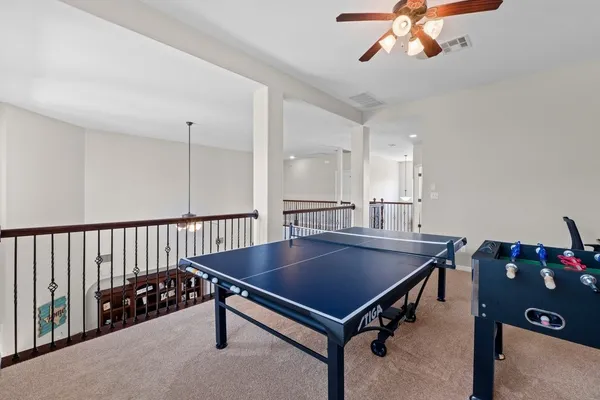a dining room with a table and chairs
