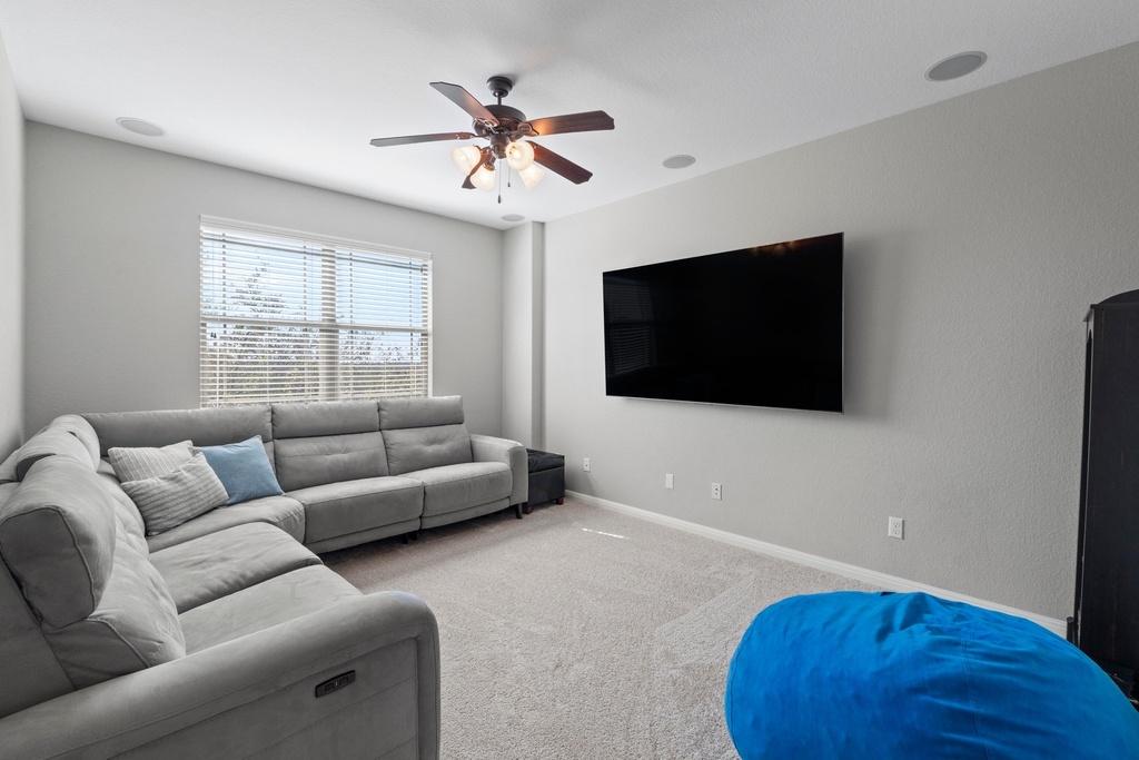 15104 Spillman Ranch Loop Austin, TX 78738 - Photo 18 of 31 a living room with furniture and a flat screen tv