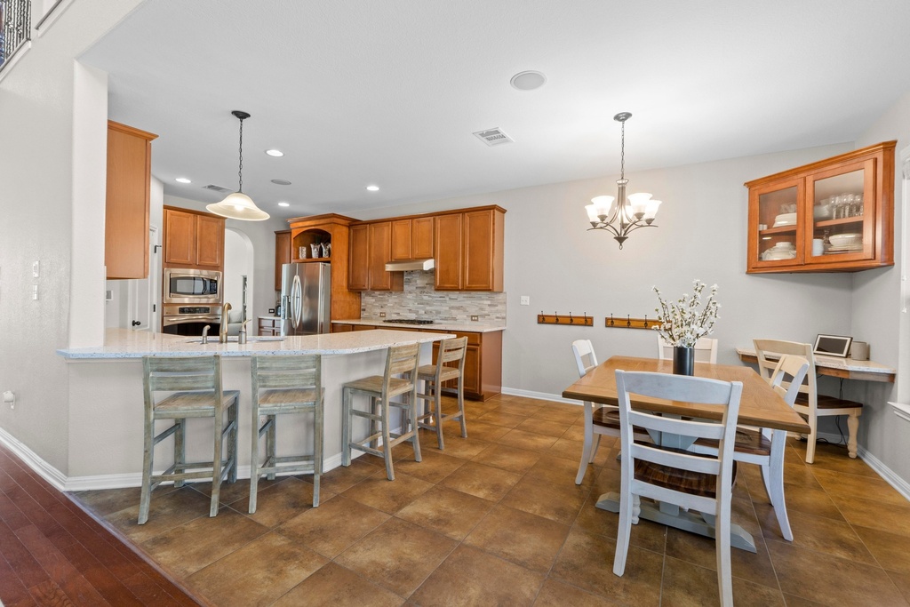 15104 Spillman Ranch Loop Austin, TX 78738 - Photo 5 of 31 a view of kitchen with breakfast area