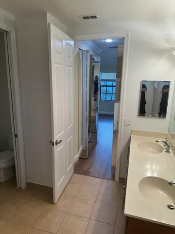 a bathroom with a sink and mirror