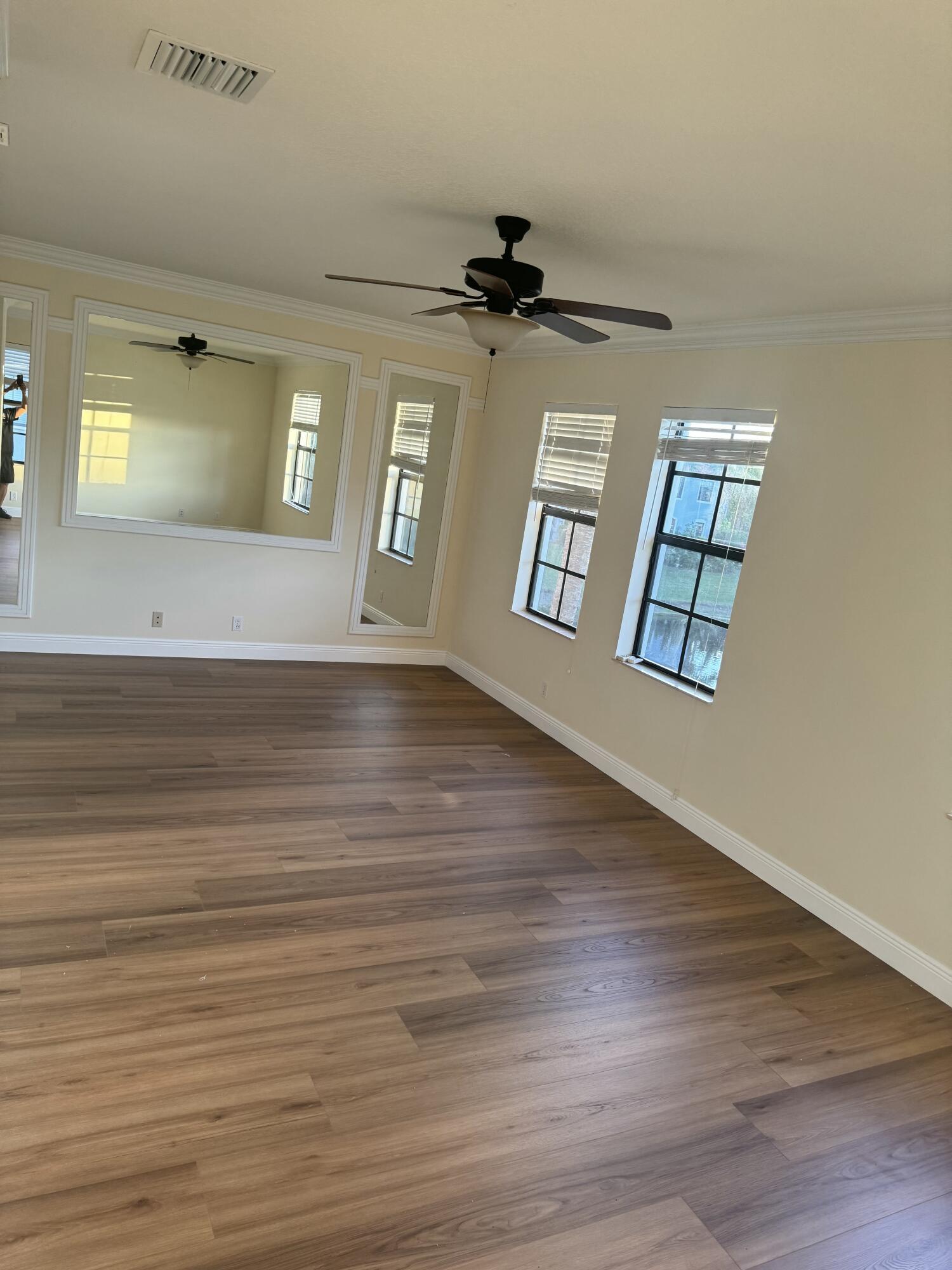 168 Astor Circle Delray Beach, FL 33484 - Photo 16 of 18 wooden floor in an empty room with a window