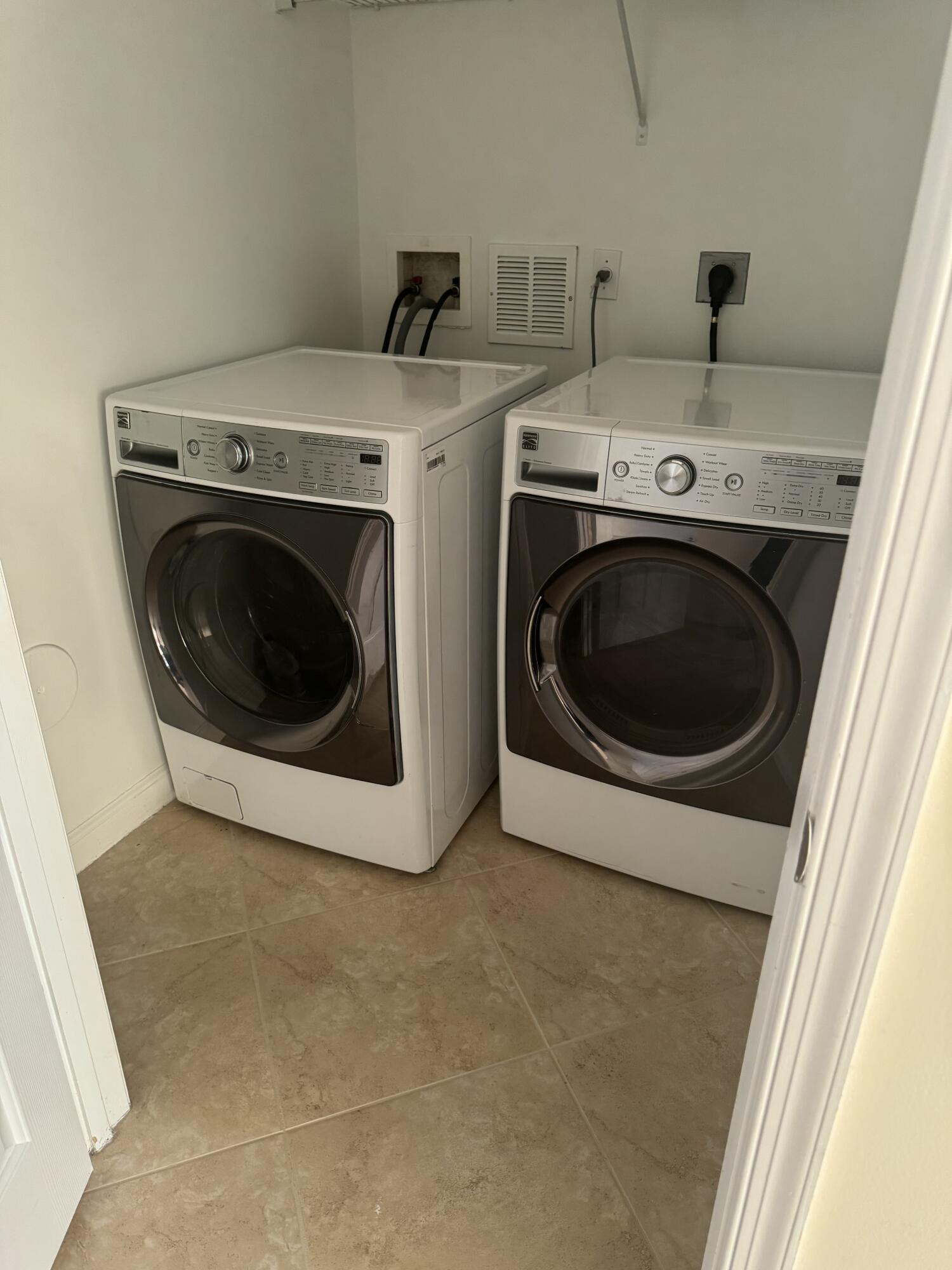 168 Astor Circle Delray Beach, FL 33484 - Photo 6 of 18 a utility room with dryer and washer