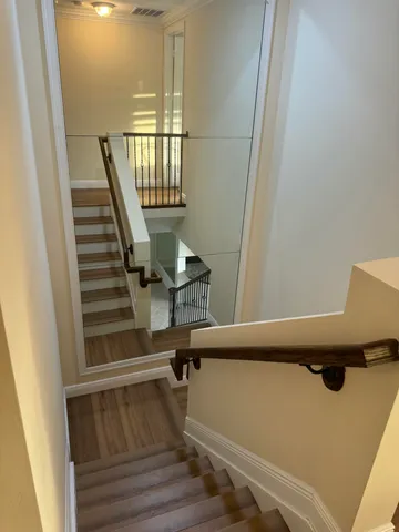 a view of entryway with wooden floor