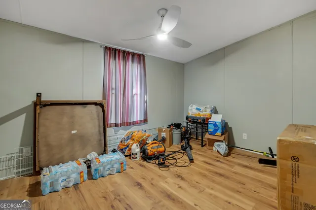 a view of a room with bed and furniture