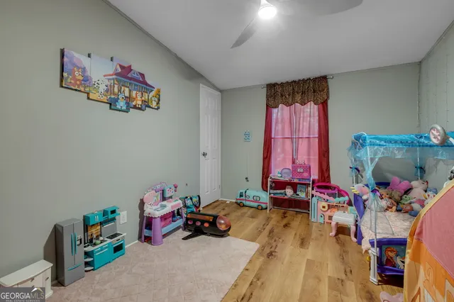 a room with furniture toys and a chandelier