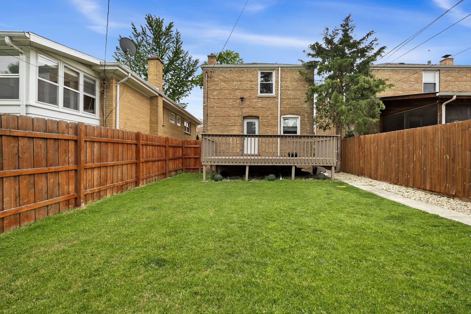 4237 Park Avenue Brookfield, IL 60513 - Photo 17 of 20 a view of a backyard with wooden fence