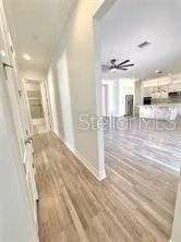 a view of a livingroom with wooden floor