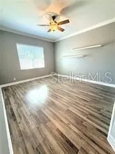 a view of wooden floor with windows