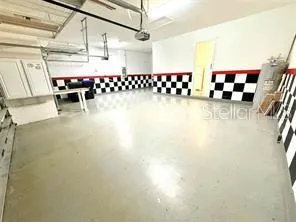 a view of a room with lots of gym equipment