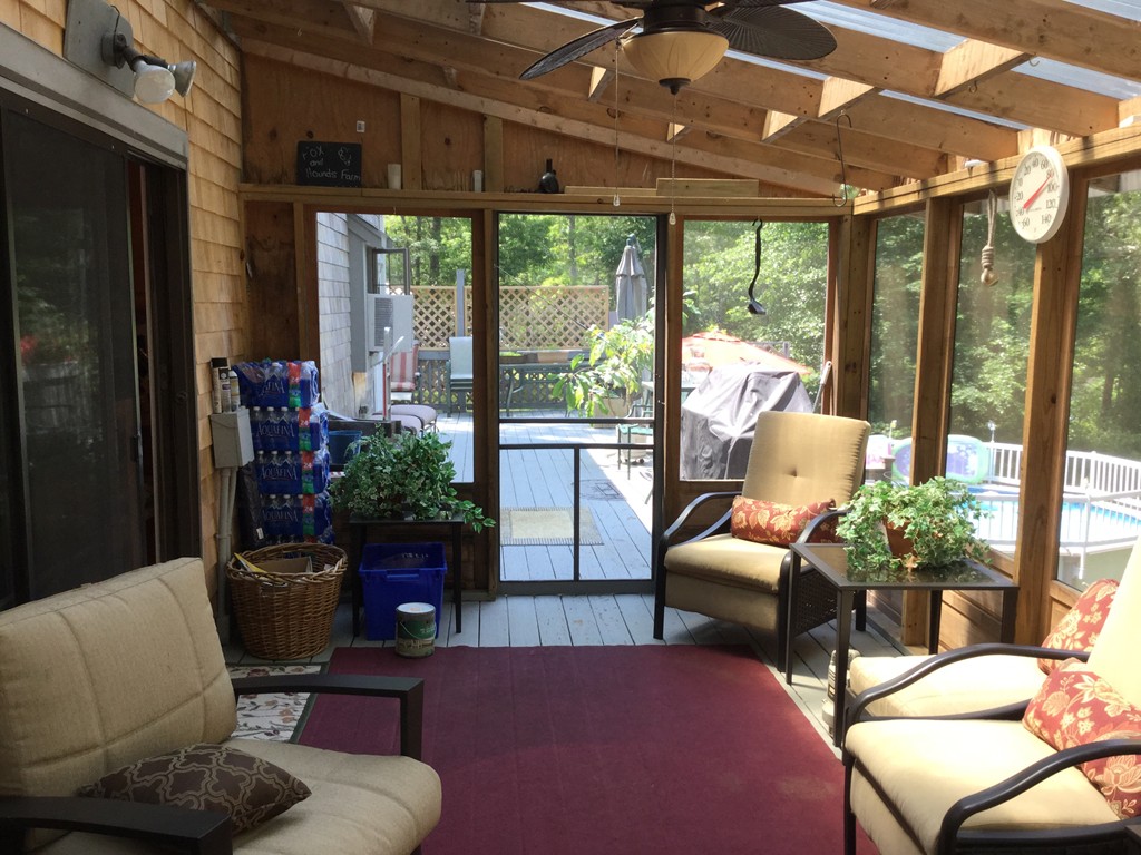 28 Deerfield Road Mashpee, MA 02649 - Photo 13 of 19 a living room with furniture and a large window