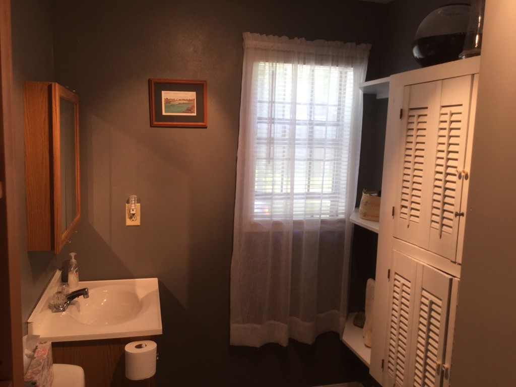 28 Deerfield Road Mashpee, MA 02649 - Photo 15 of 19 a bathroom with a sink and a mirror