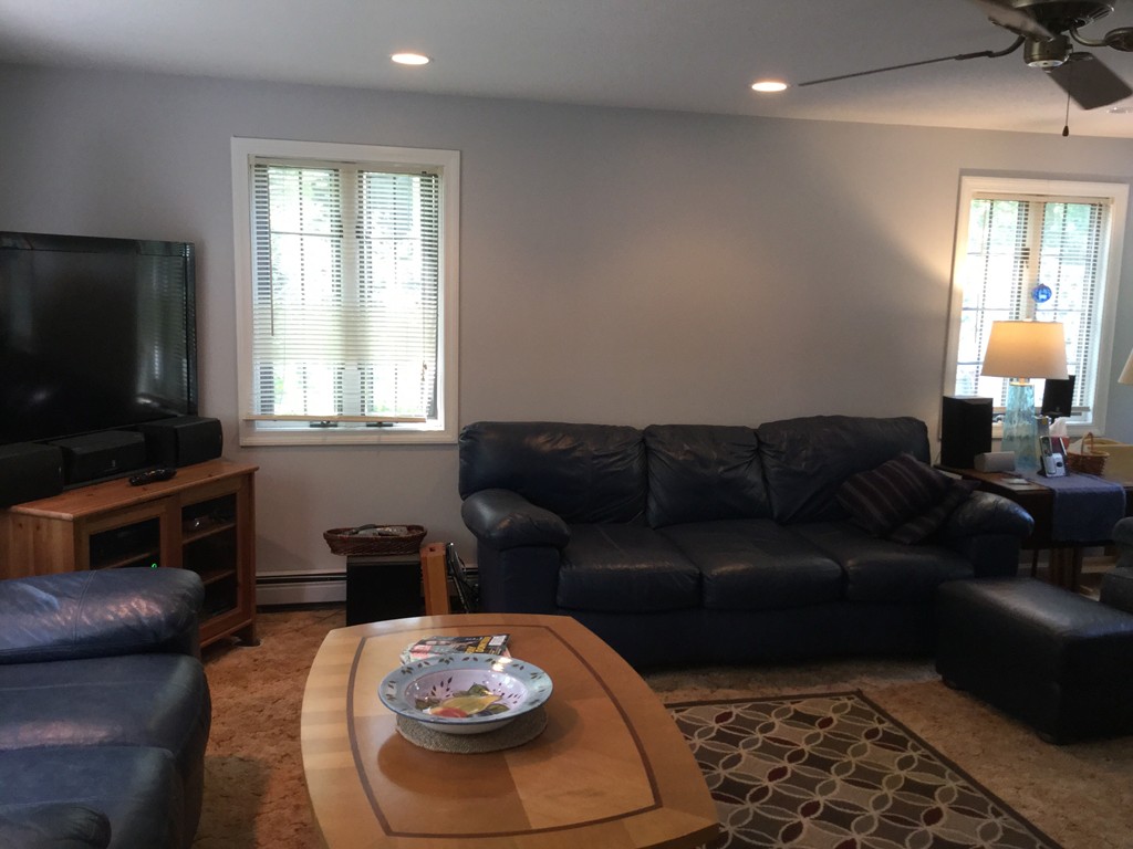 28 Deerfield Road Mashpee, MA 02649 - Photo 18 of 19 a living room with furniture a flat screen tv and a window
