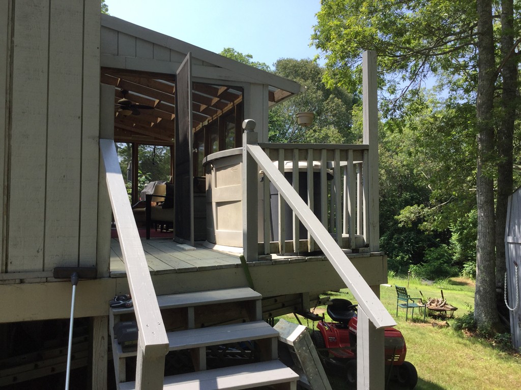 28 Deerfield Road Mashpee, MA 02649 - Photo 4 of 19 a view of deck with chairs and wooden fence