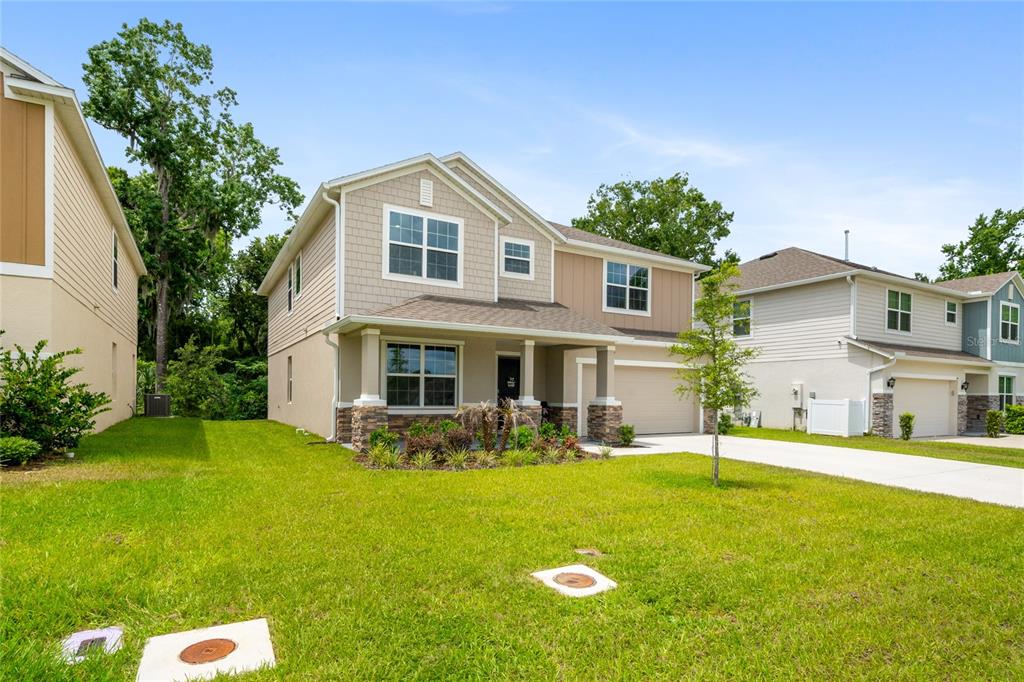 1137 Bradford Rdg Drive Leesburg, FL 34748 - Photo 2 of 37 a front view of house with yard and green space
