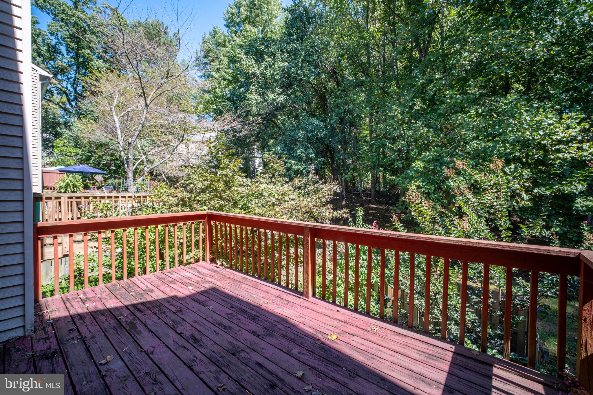 11521 Shell Flower Lane Columbia, MD 21044 - Photo 22 of 31 a view of balcony with wooden floor and fence