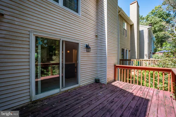 a view of backyard with a deck