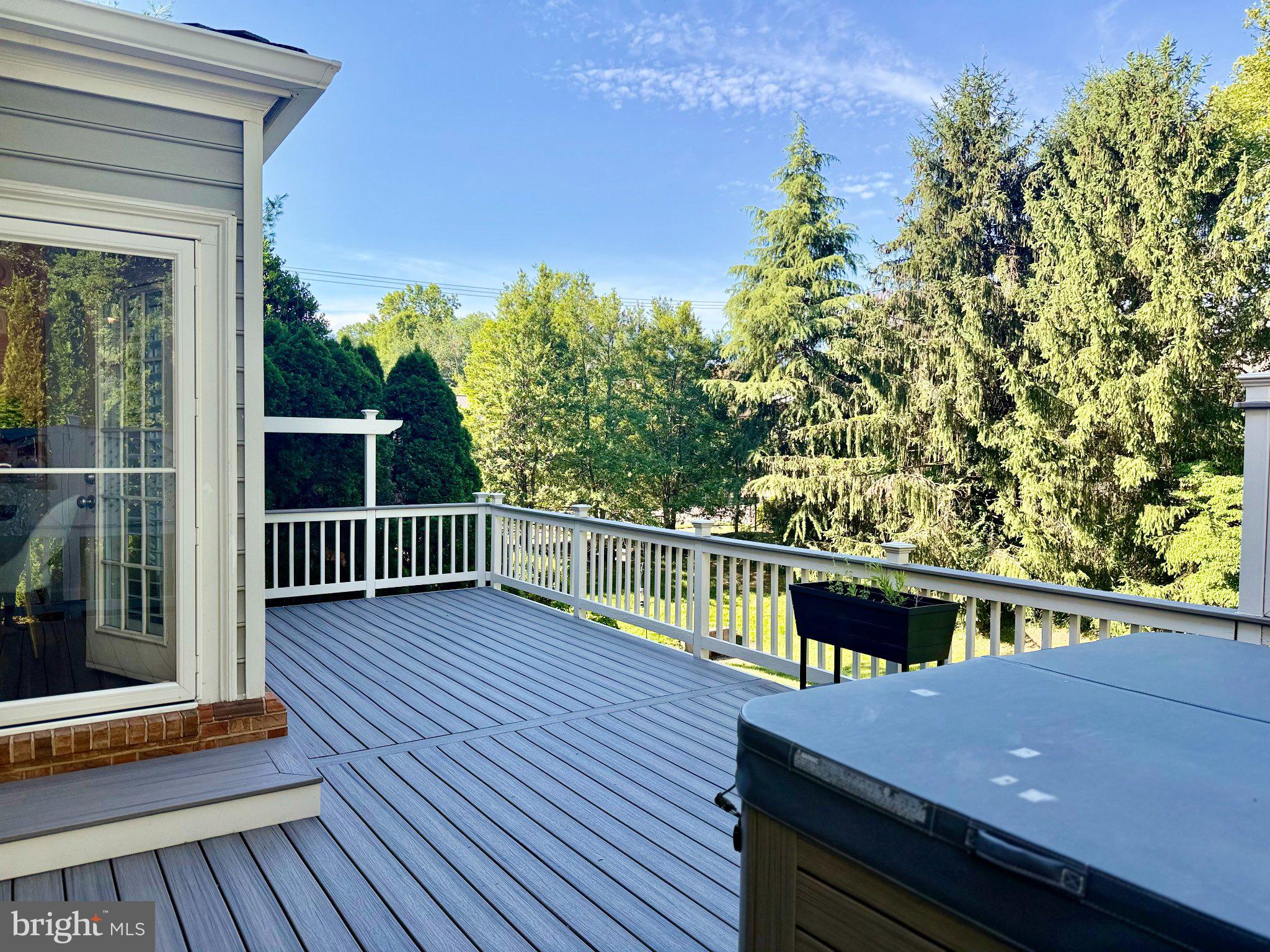 9733 Hidden Road Vienna, VA 22181 - Photo 4 of 39 Serene deck with lush green views.