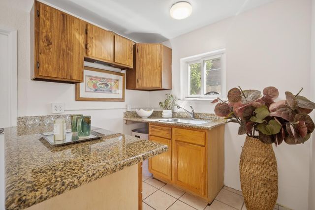 a bedroom with bed and a window