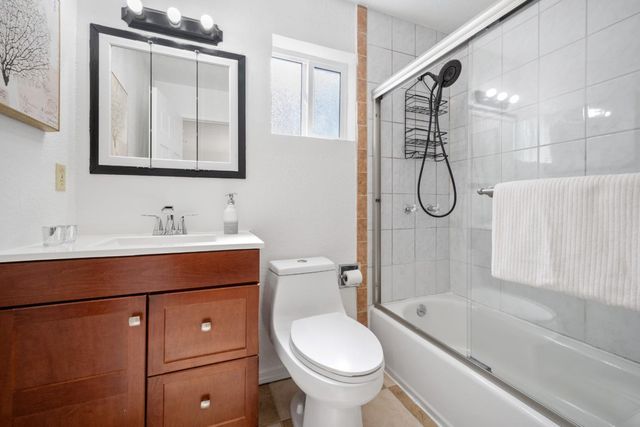 a view of a dinning table and chairs in patio