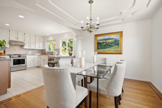 a kitchen with a stove a sink and a refrigerator