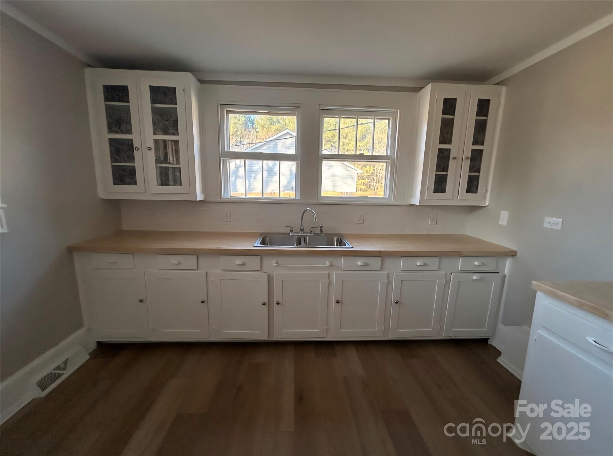 36040 Palestine Road Albemarle, NC 28001 - Photo 13 of 43 a kitchen with a sink window and cabinets