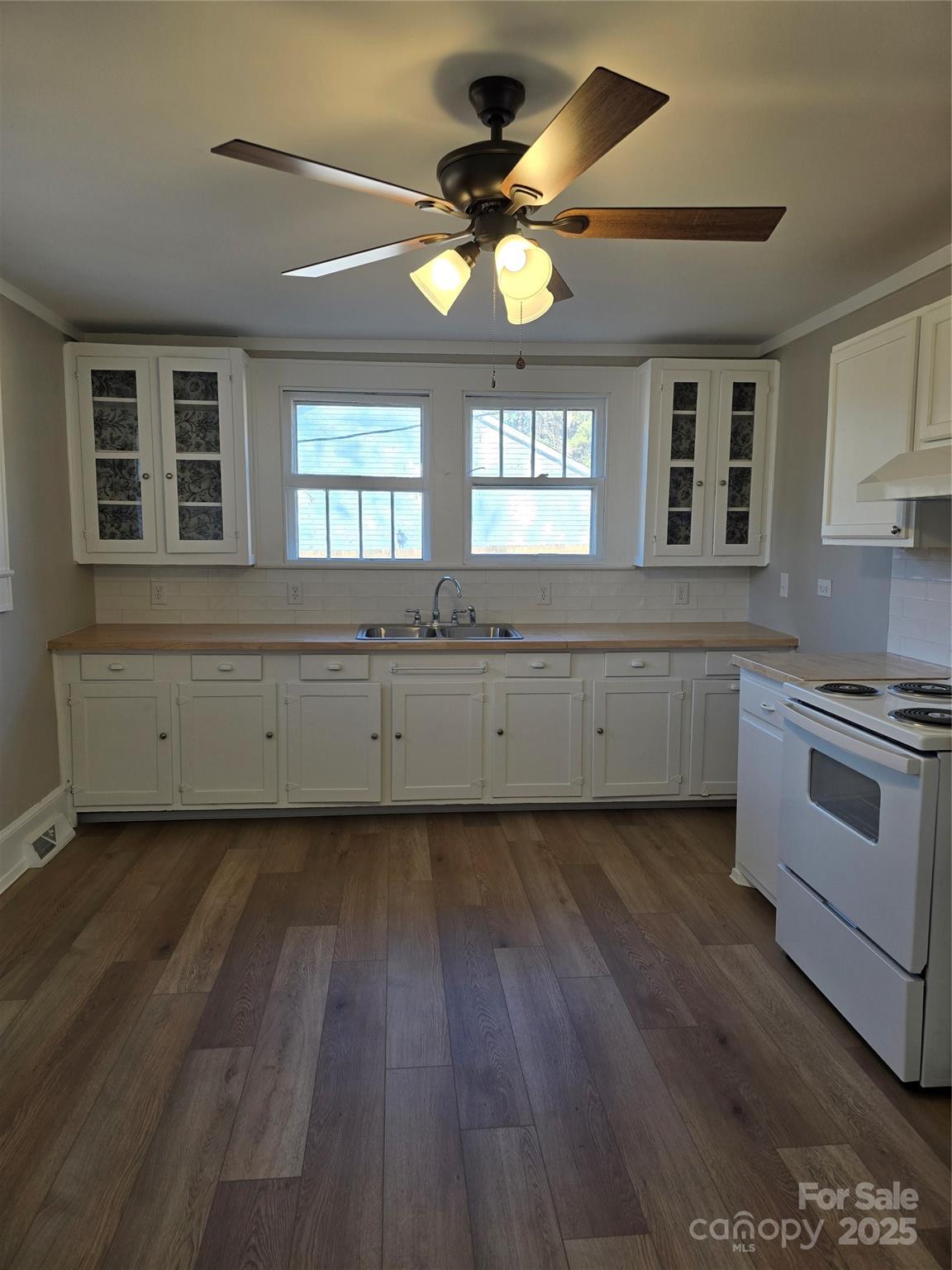 36040 Palestine Road Albemarle, NC 28001 - Photo 14 of 43 a large kitchen with hardwood floor and a window