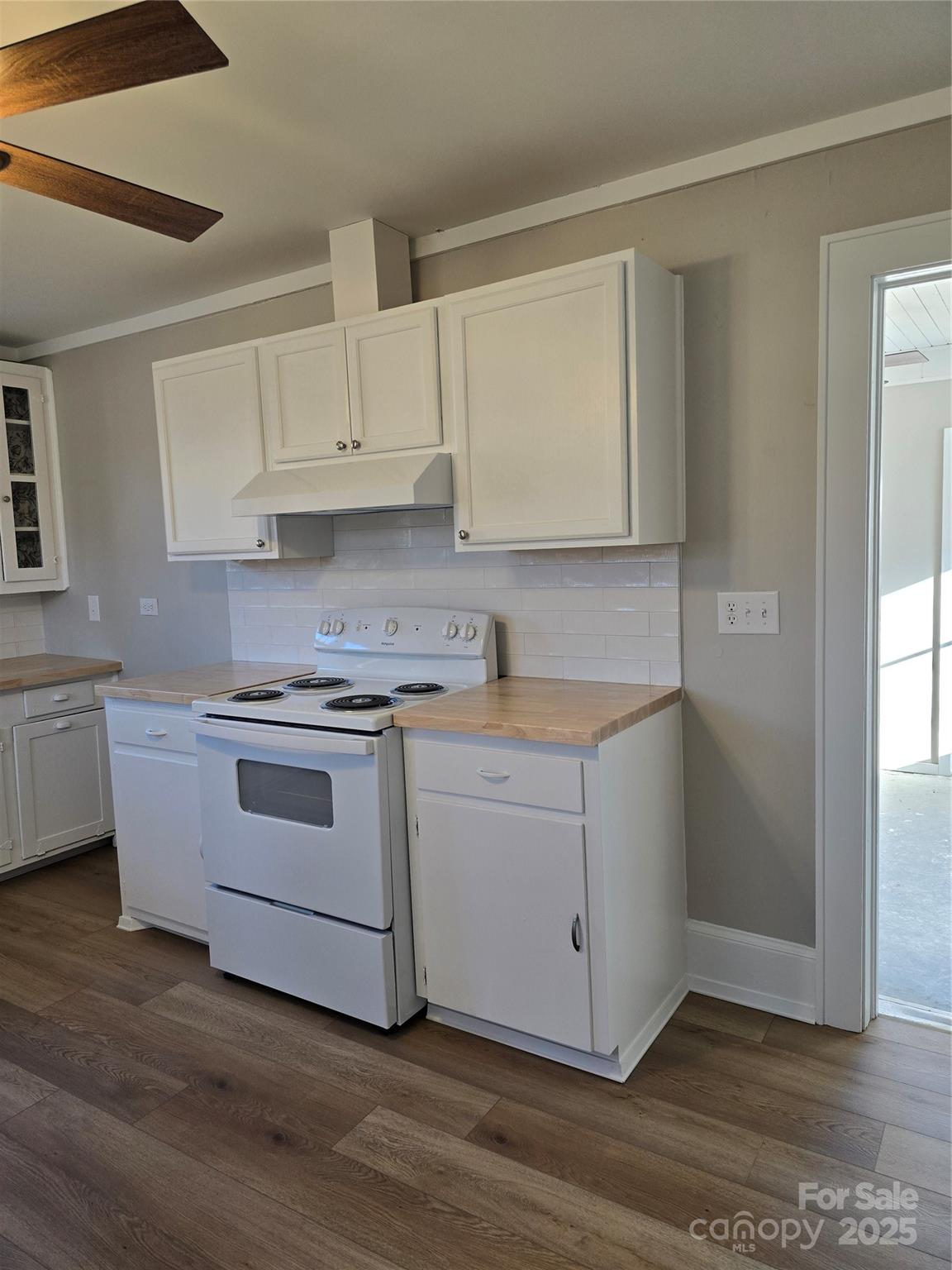36040 Palestine Road Albemarle, NC 28001 - Photo 16 of 43 a kitchen with white cabinets and white appliances