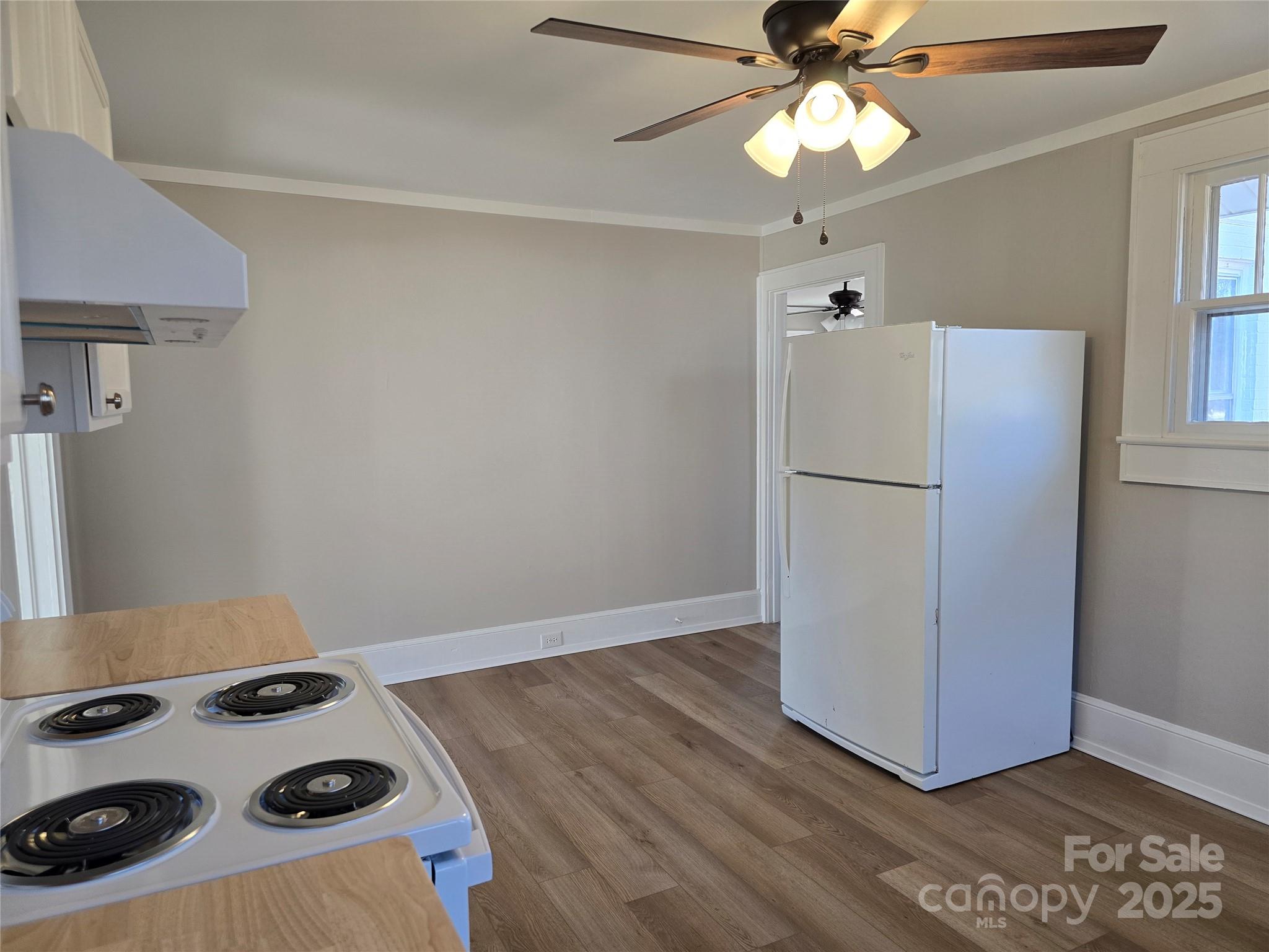 36040 Palestine Road Albemarle, NC 28001 - Photo 17 of 43 a kitchen with a refrigerator and a stove