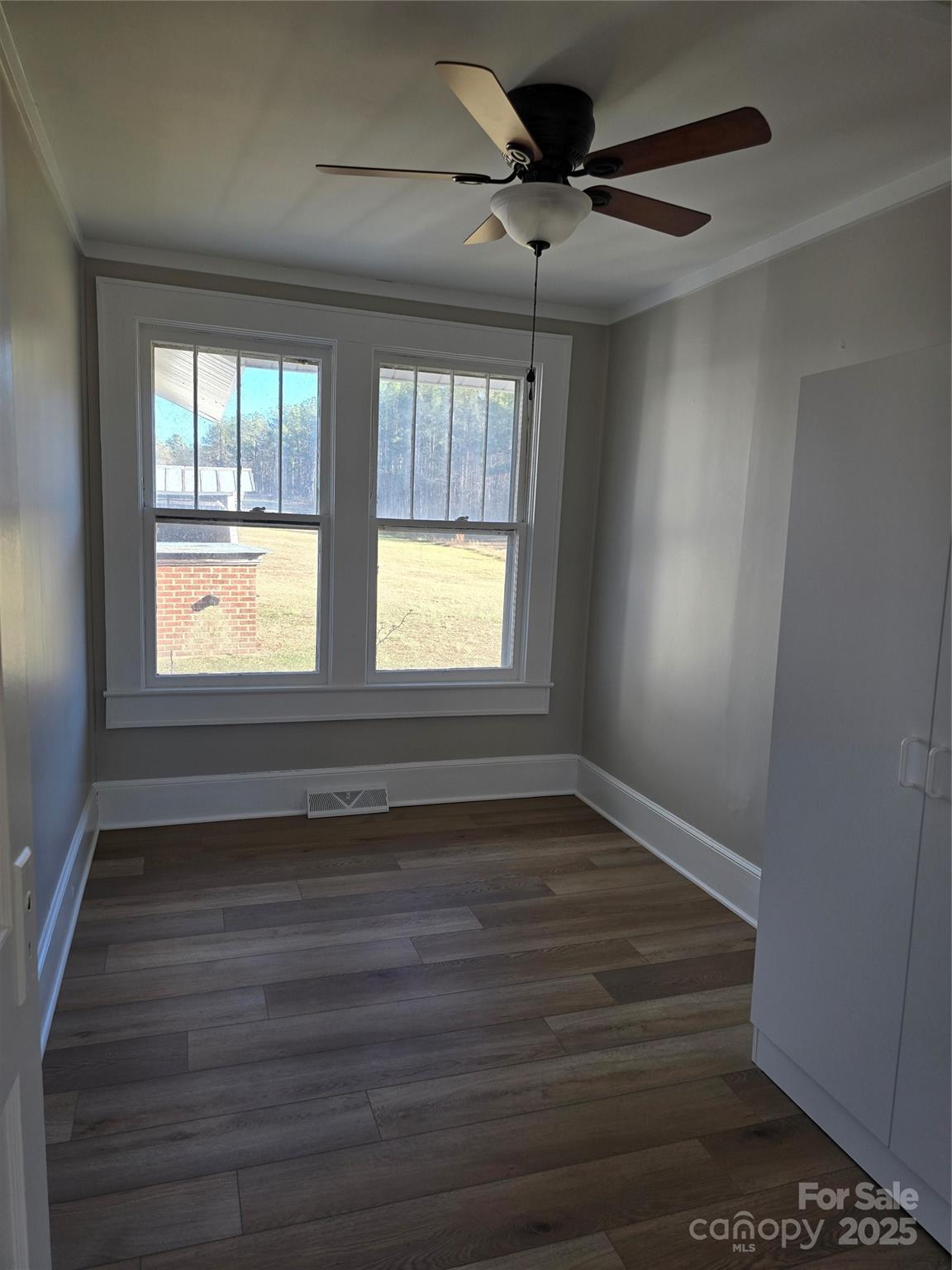 36040 Palestine Road Albemarle, NC 28001 - Photo 18 of 43 a view of an empty room with wooden floor and a window