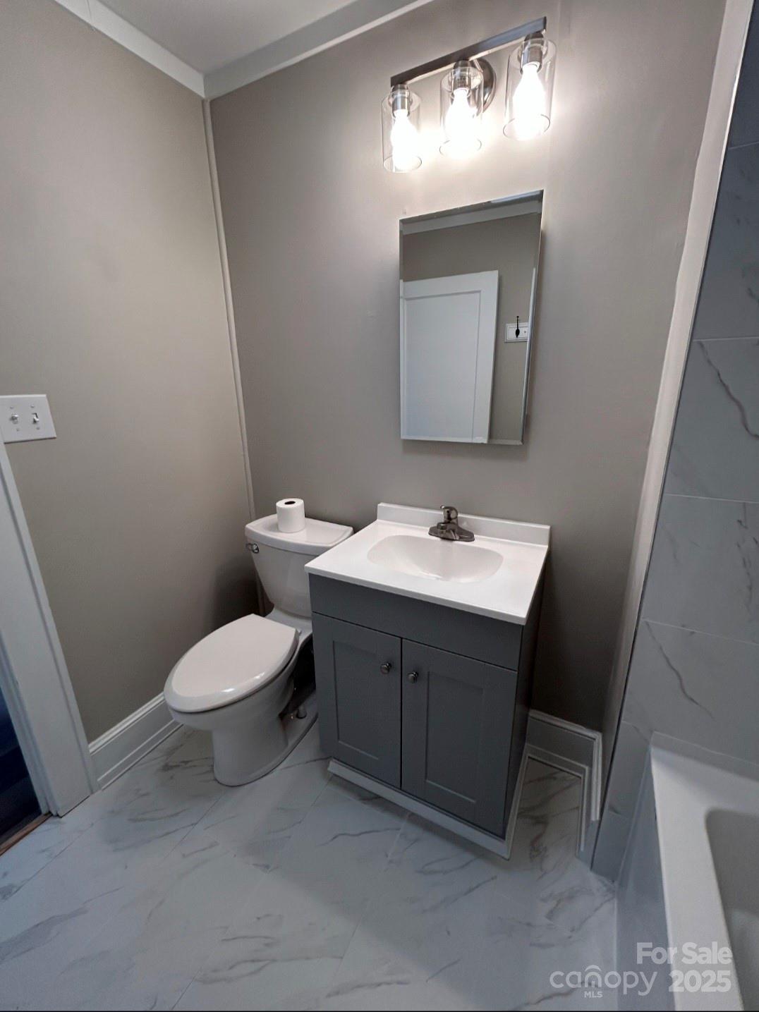 36040 Palestine Road Albemarle, NC 28001 - Photo 23 of 43 a bathroom with a toilet sink and mirror