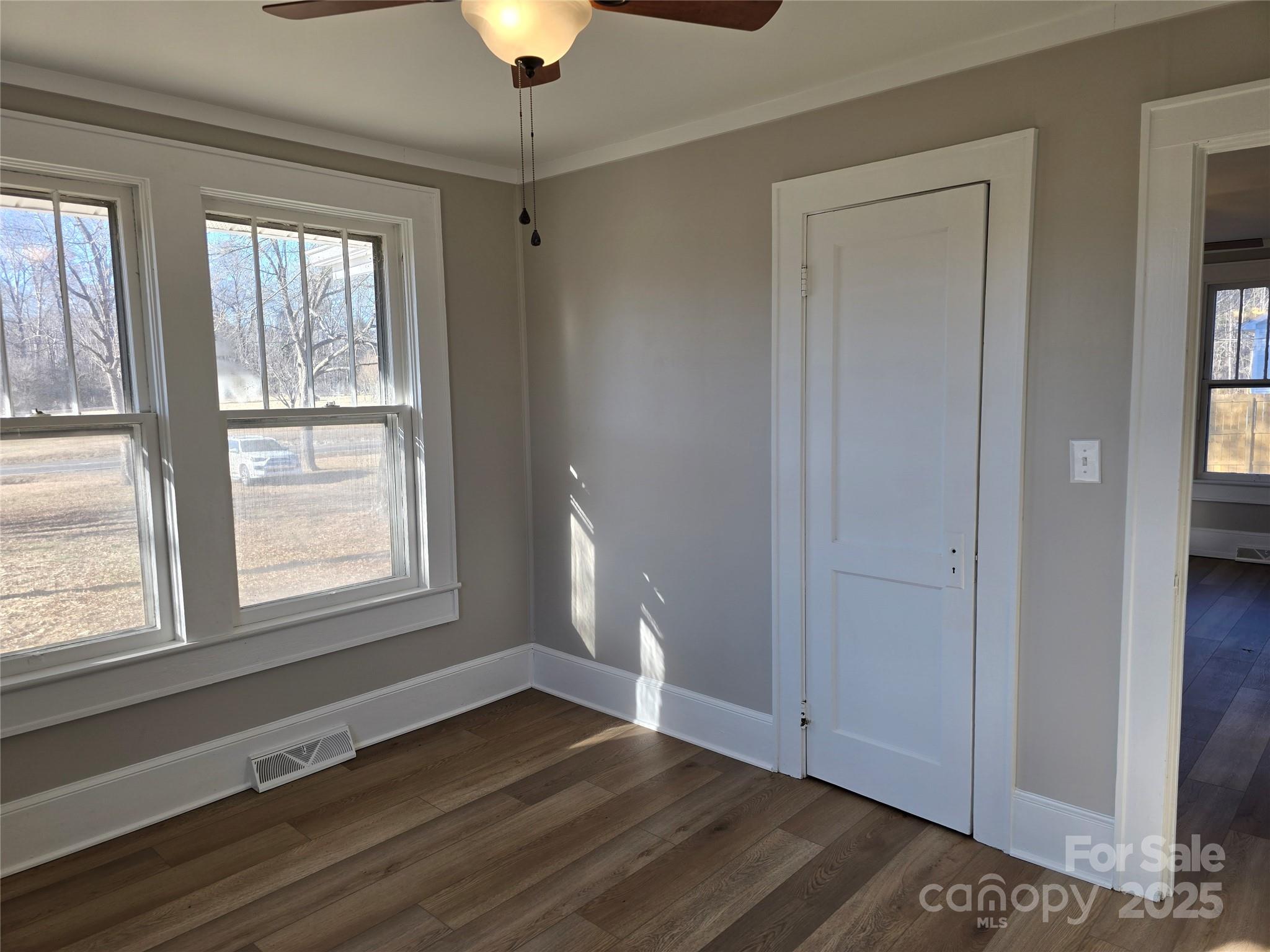 36040 Palestine Road Albemarle, NC 28001 - Photo 26 of 43 a view of an empty room with wooden floor and a window