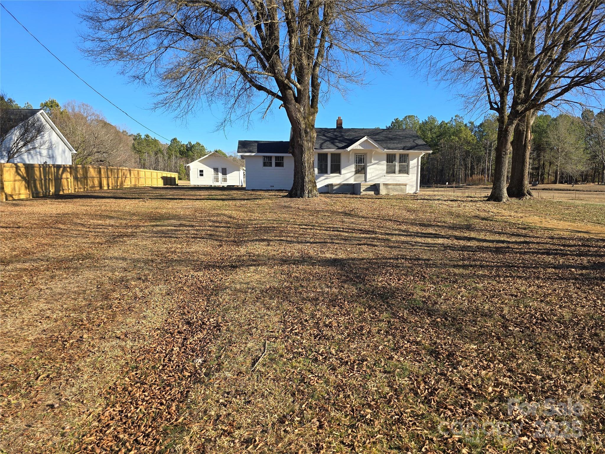 36040 Palestine Road Albemarle, NC 28001 - Photo 3 of 43 a house with trees in front of it