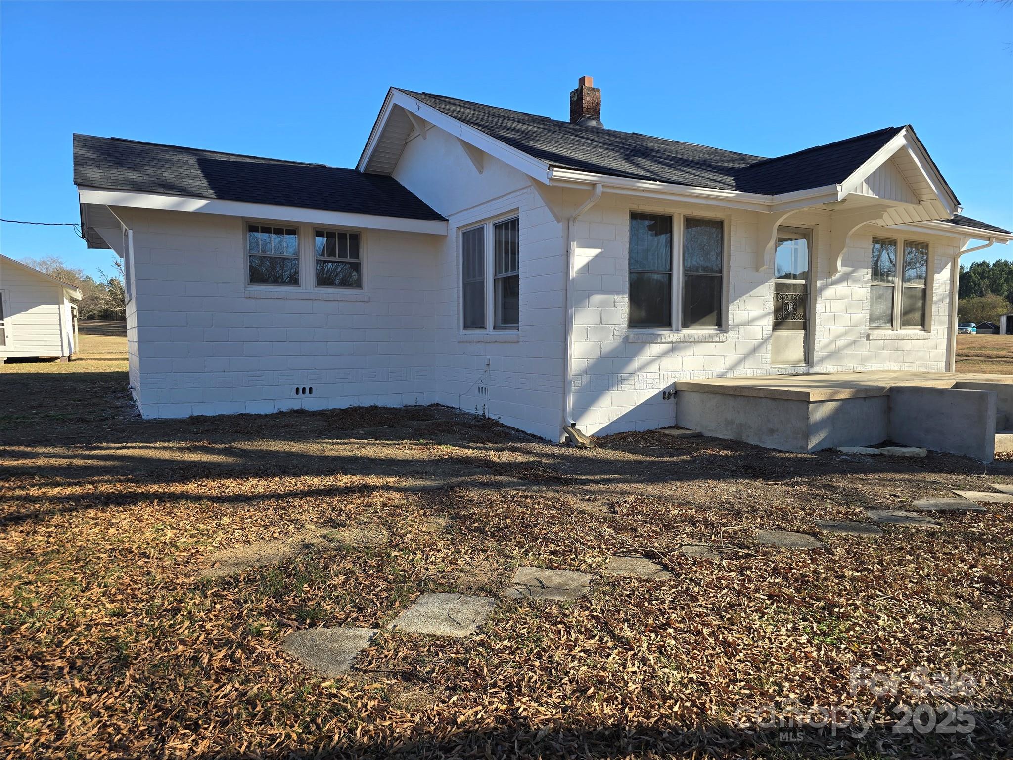 36040 Palestine Road Albemarle, NC 28001 - Photo 4 of 43 a front view of a house with a yard