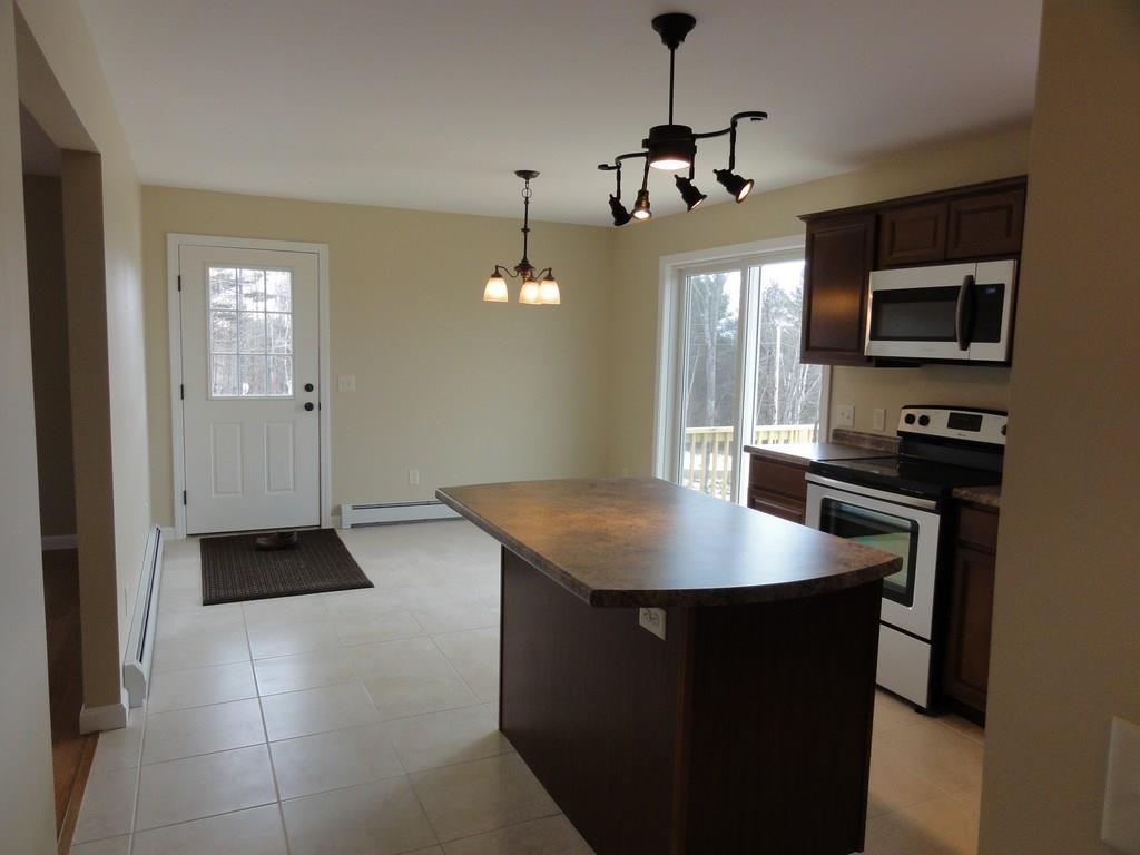Kitchen with tile floors, sliding...