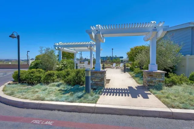 a view of a patio with table and chairs and potted plants