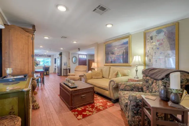 a living room with furniture fireplace and a window