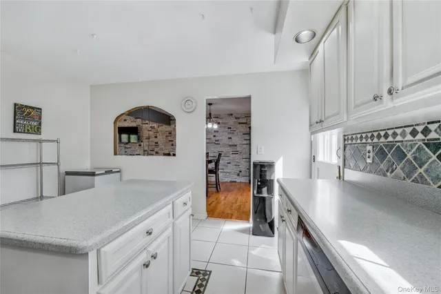 a kitchen with stainless steel appliances a stove a sink and a refrigerator