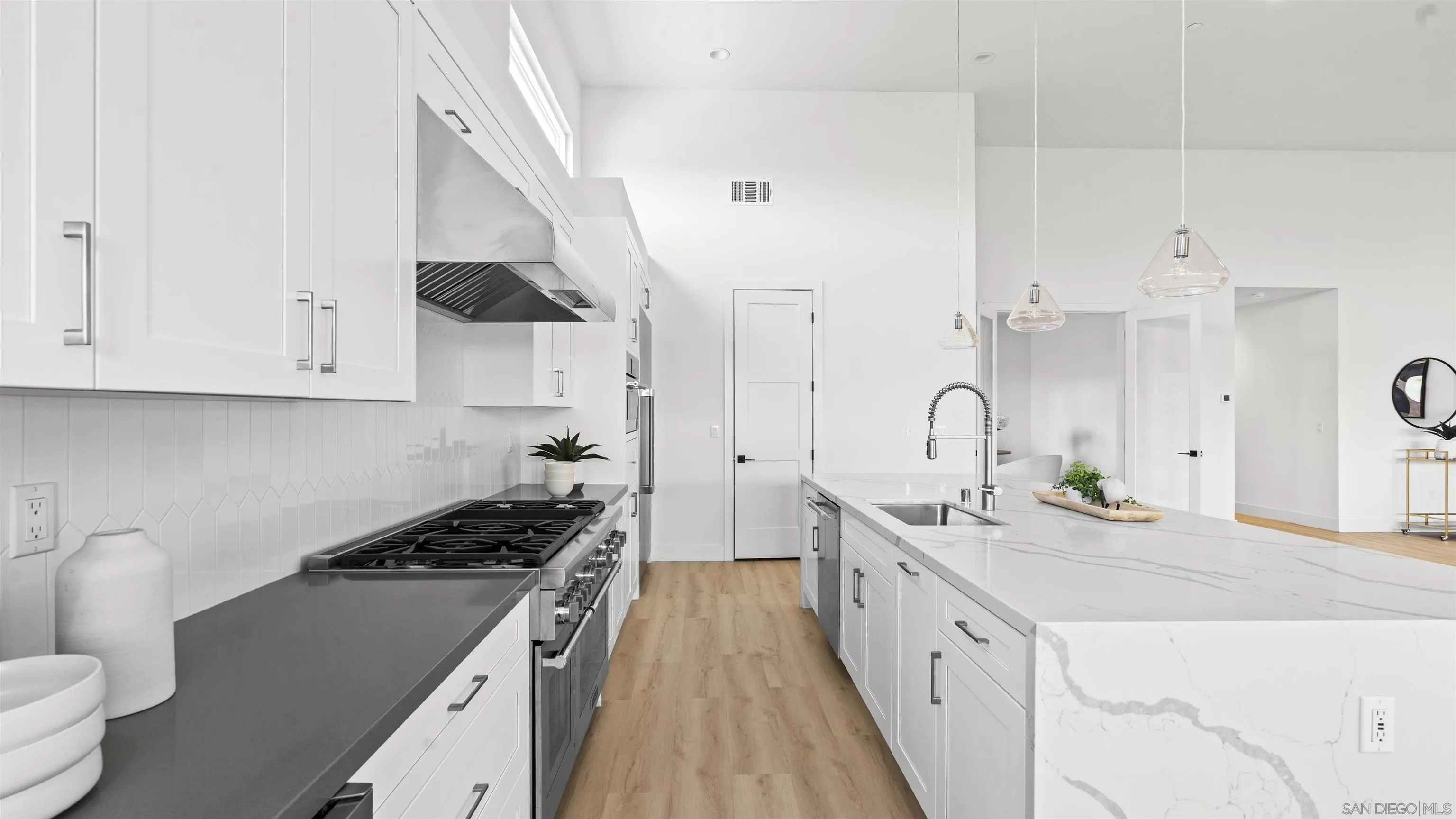16925 Old Coach Road Poway, CA 92064 - Photo 13 of 53 a large white kitchen with stainless steel appliances