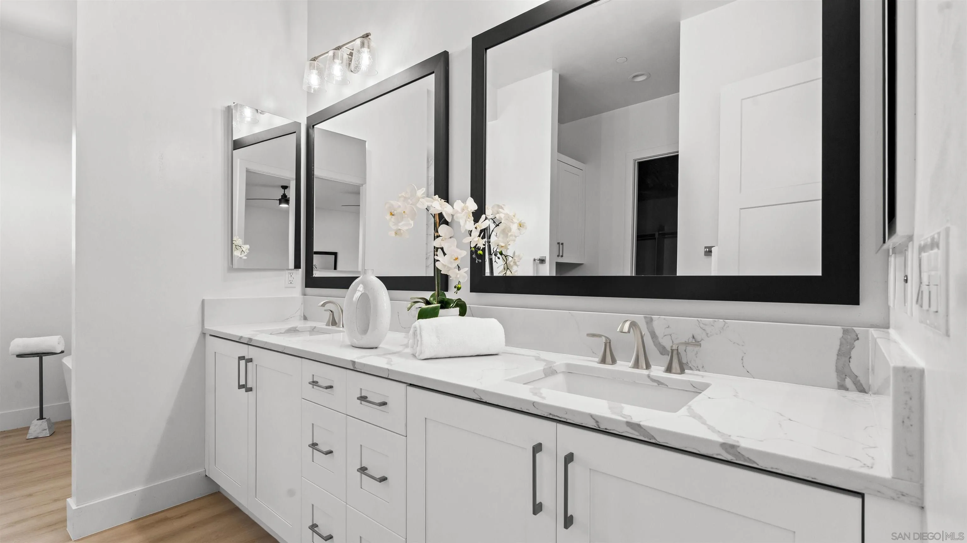 16925 Old Coach Road Poway, CA 92064 - Photo 21 of 53 a bathroom with double sink and a mirror