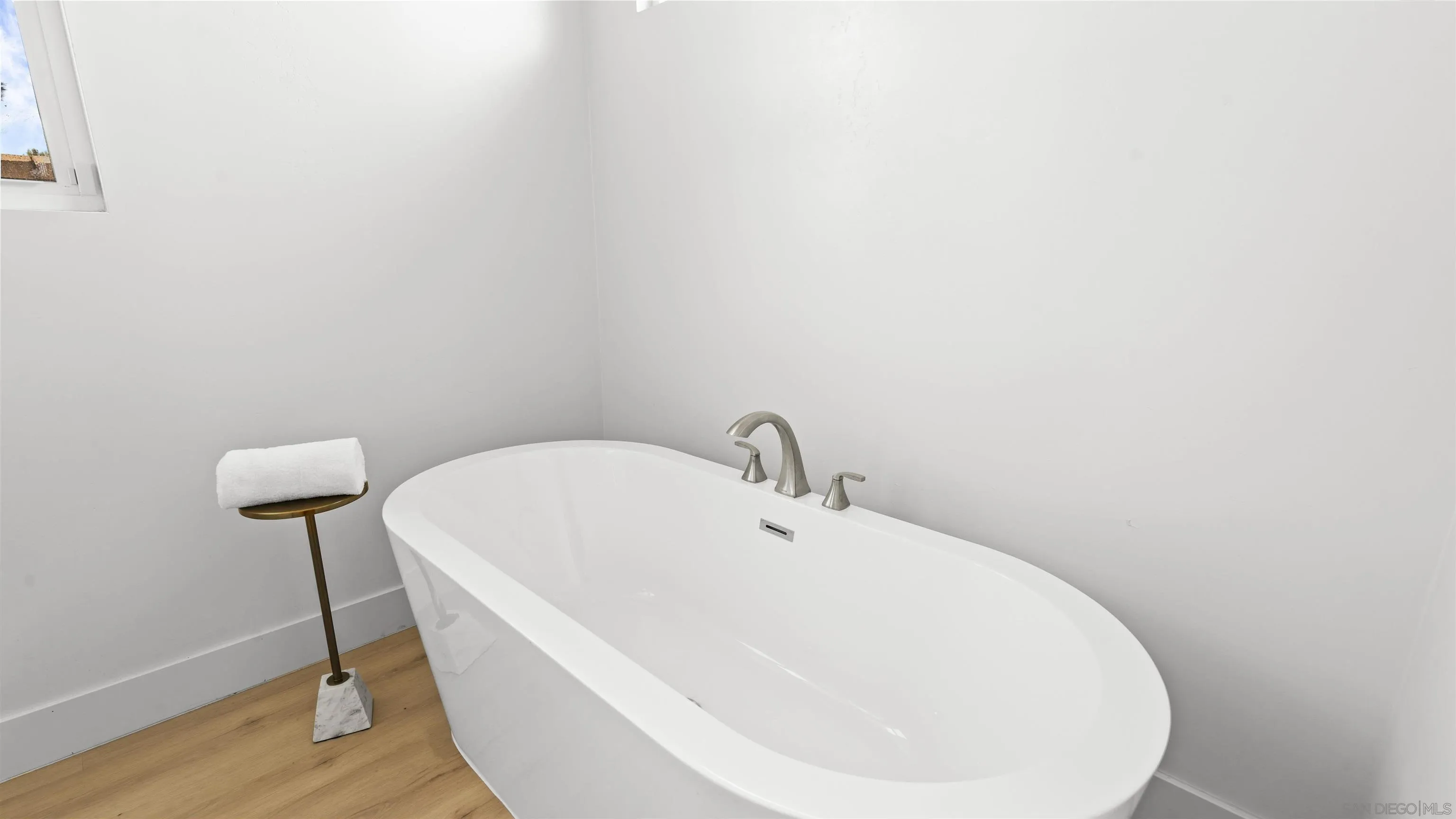 16925 Old Coach Road Poway, CA 92064 - Photo 24 of 53 a white bath tub sitting in a bathroom