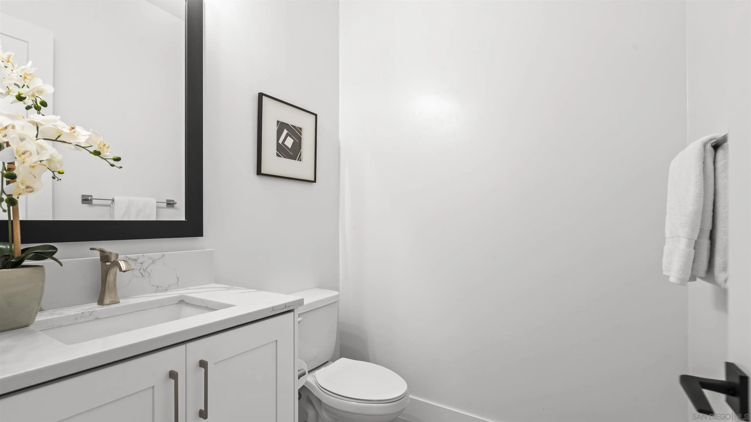 16925 Old Coach Road Poway, CA 92064 - Photo 28 of 53 a bathroom with a granite countertop sink mirror vanity and toilet