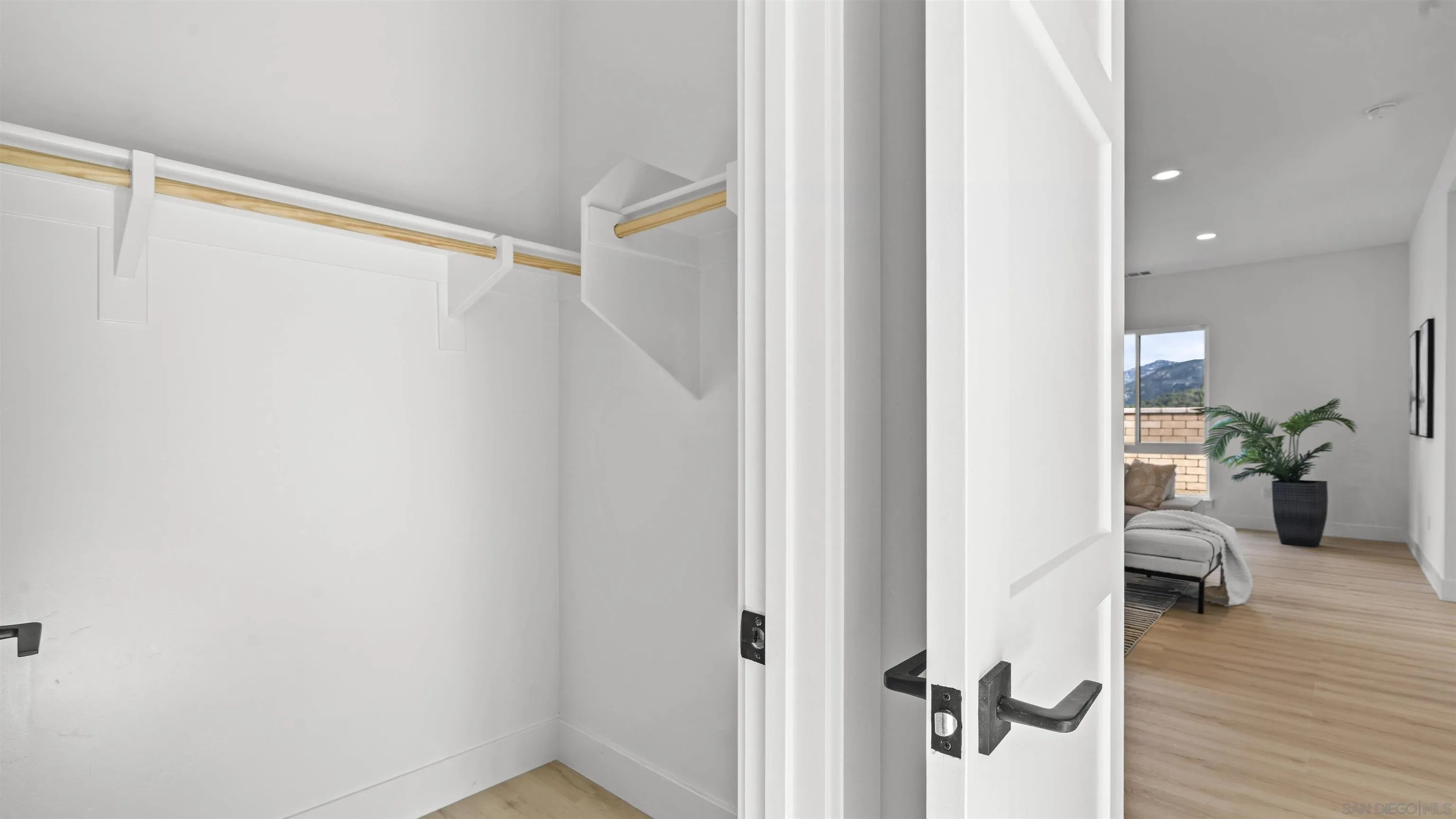 16925 Old Coach Road Poway, CA 92064 - Photo 35 of 53 a view of hallway with livingroom and wooden floor