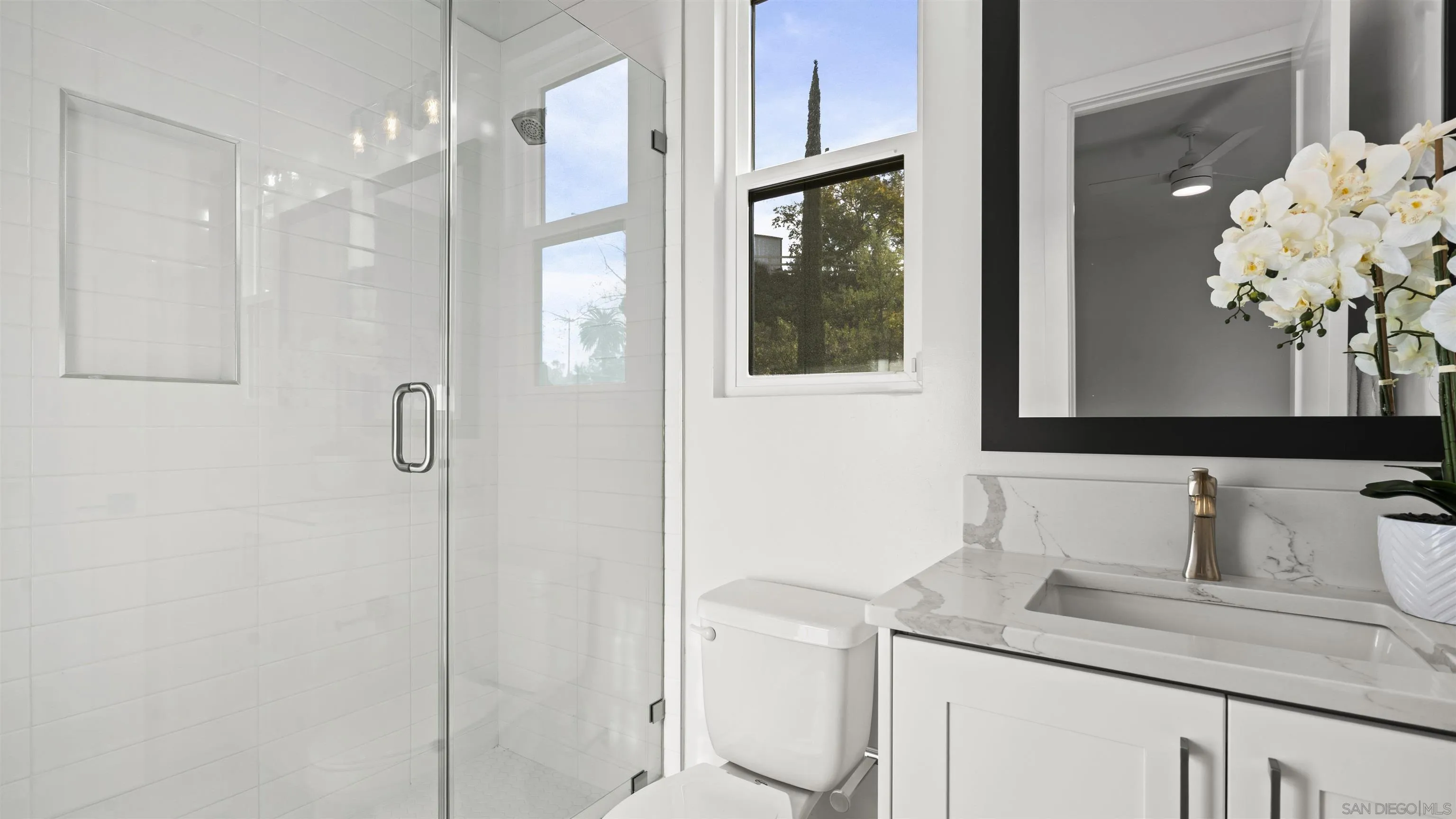 16925 Old Coach Road Poway, CA 92064 - Photo 36 of 53 a bathroom with a granite countertop sink a mirror and a shower