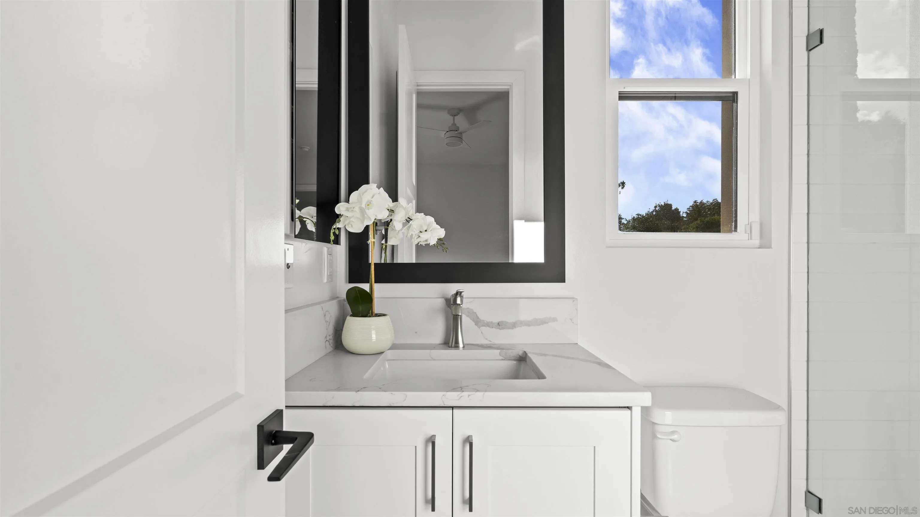 16925 Old Coach Road Poway, CA 92064 - Photo 37 of 53 a bathroom with a sink and a mirror